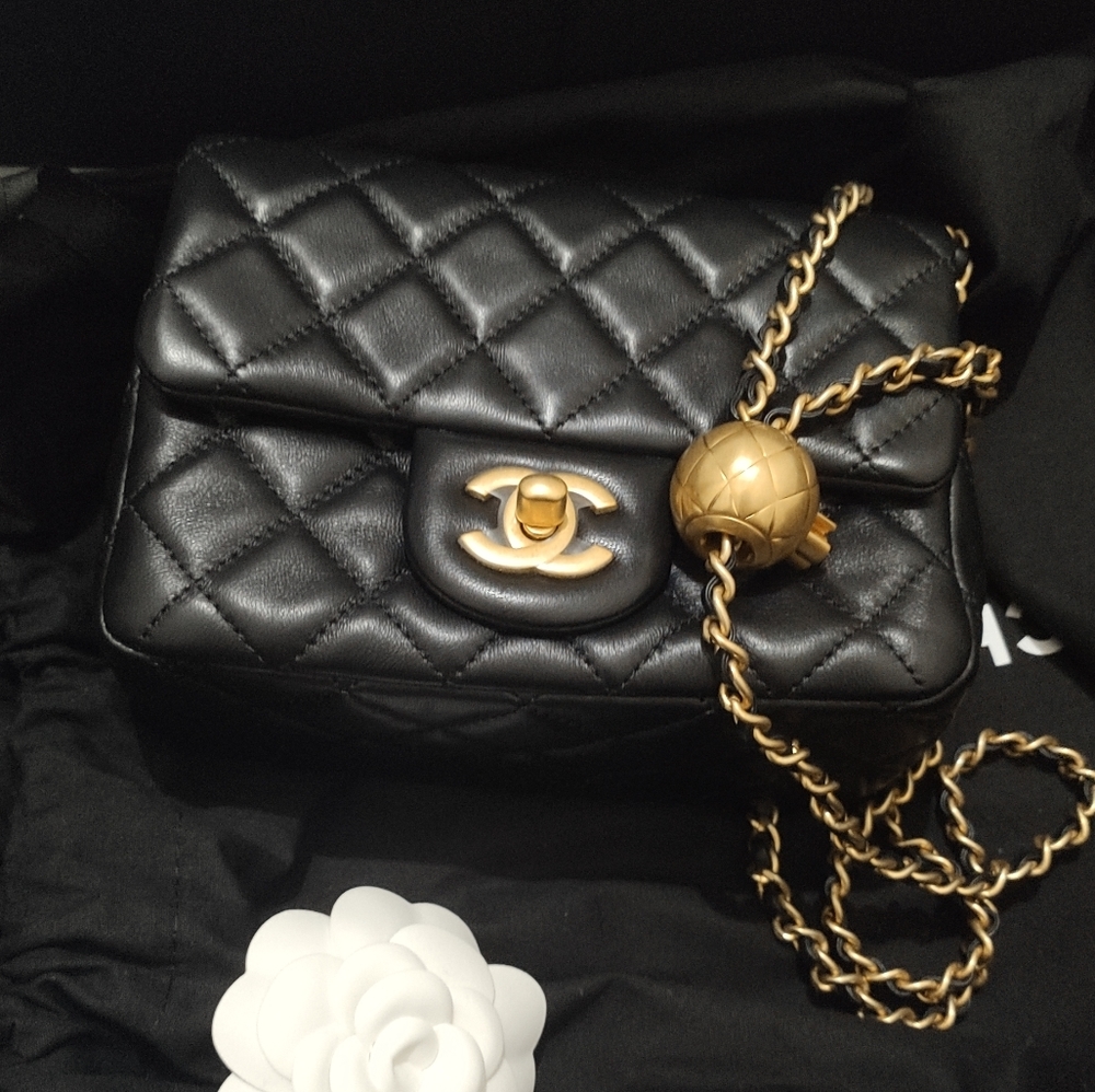 Brand new. Never used, Chanel Mini Flap square with gold ball. Pearl crush.